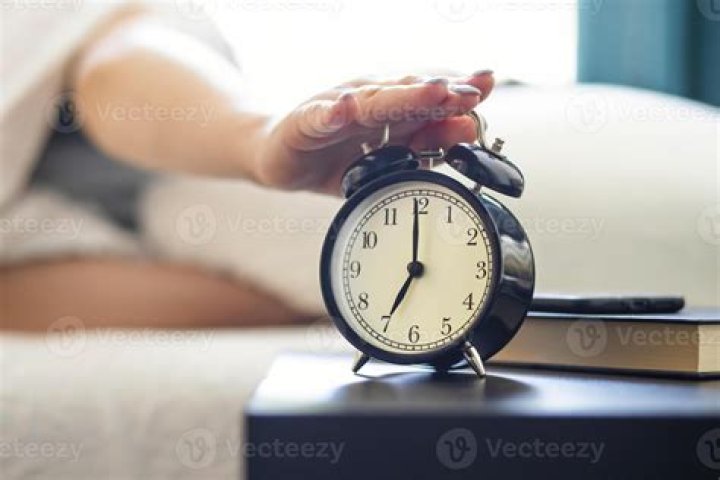 At what age should a child start using an alarm clock?