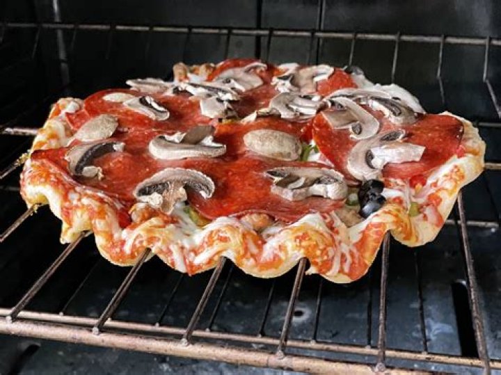 Can I put frozen pizza in oven without pan?