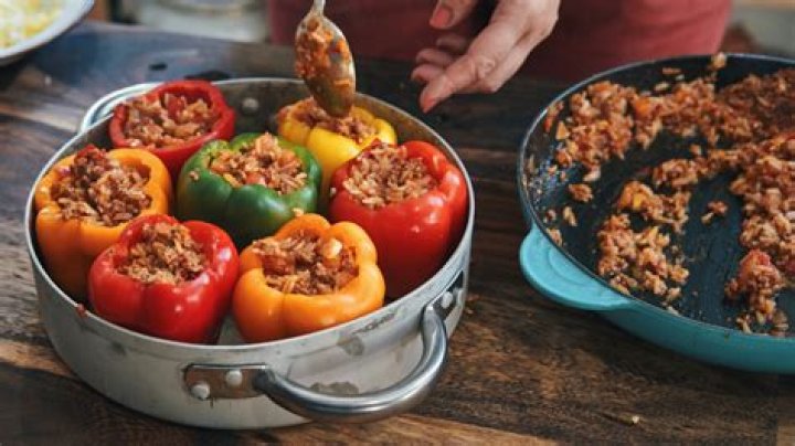 Do you have to cook meat before stuffing peppers?