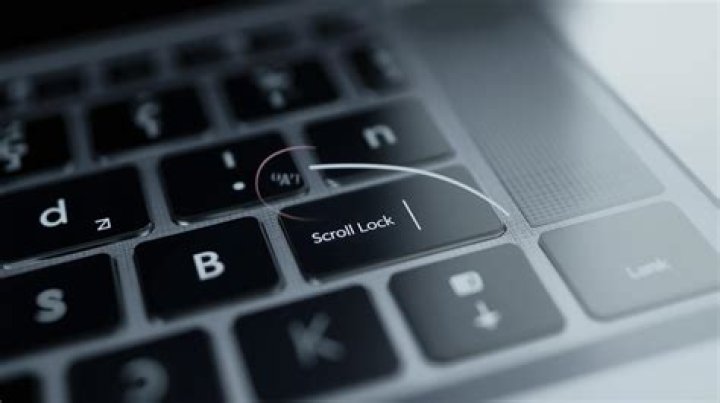 How do I turn Scroll Lock off on my laptop?