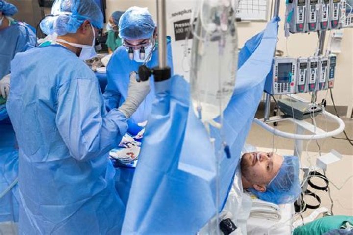 How do Surgeons reattach skull?