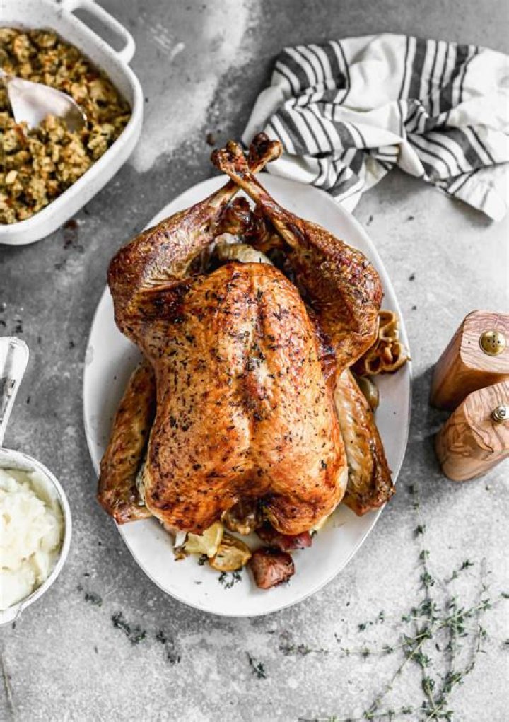 How long do you cook a stuffed turkey per pound?