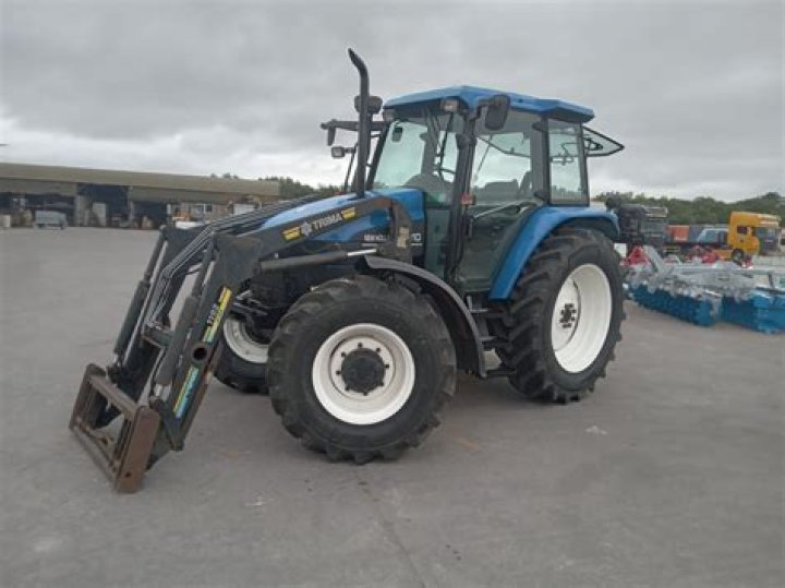 How much does a New Holland TS110 weigh?