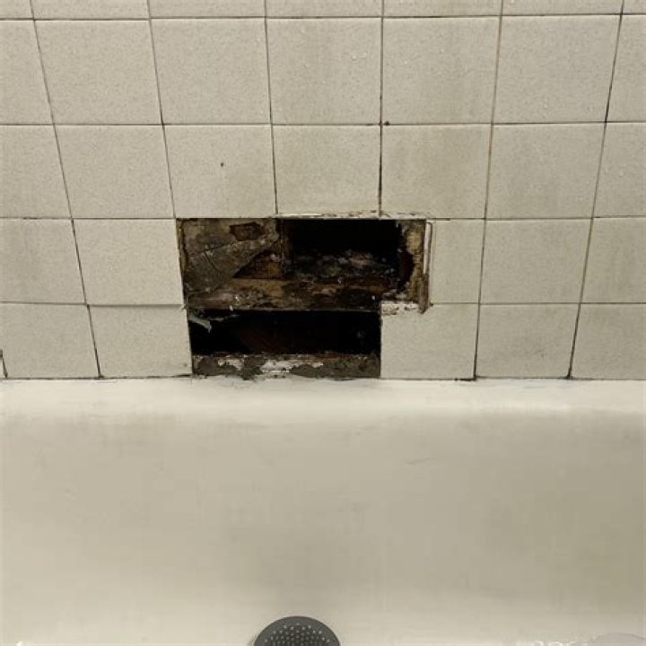 What do you use to stick a tile to a wall?