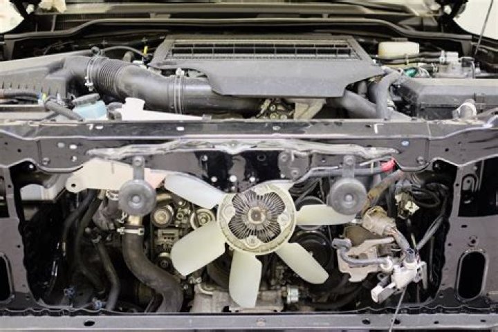Where is the engine cooling fan located?