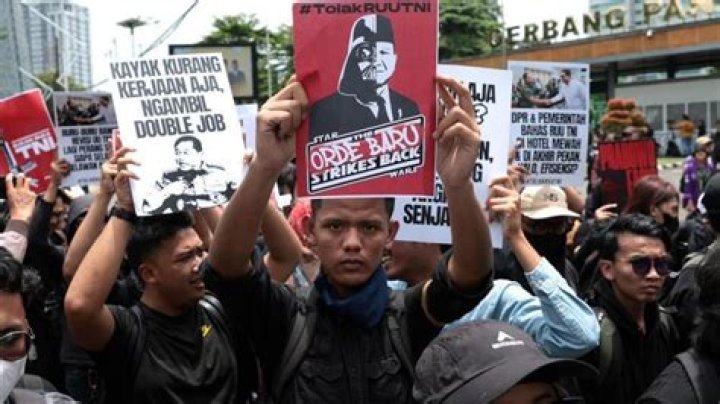 Why did the Indonesian government impose the transmigration policy?